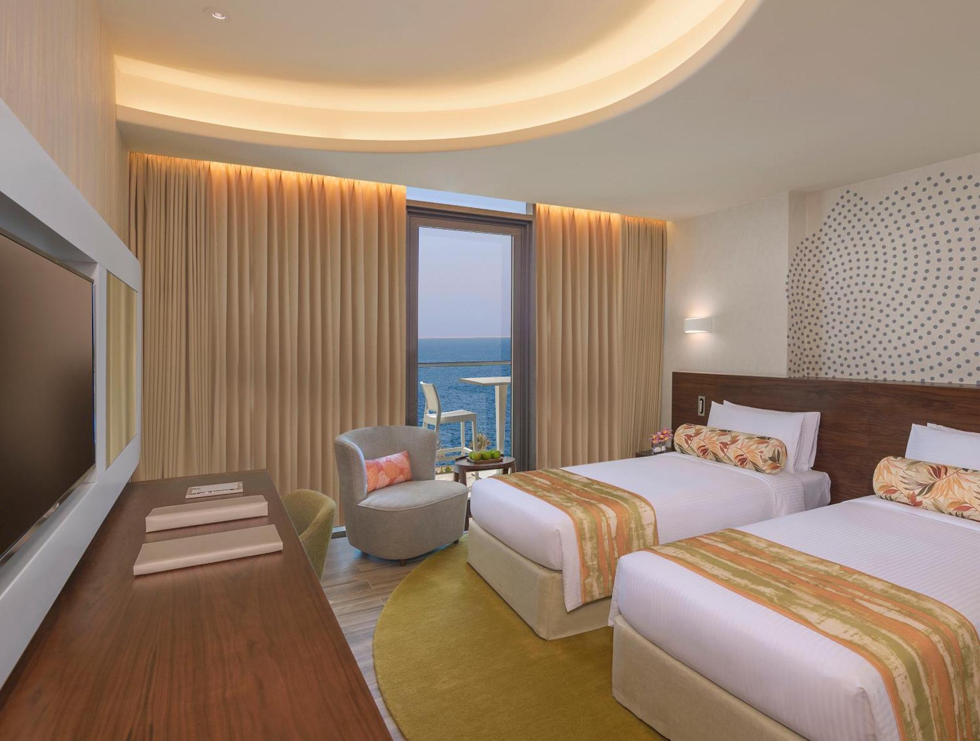 Habitación Deluxe con balcón y vistas parciales al mar