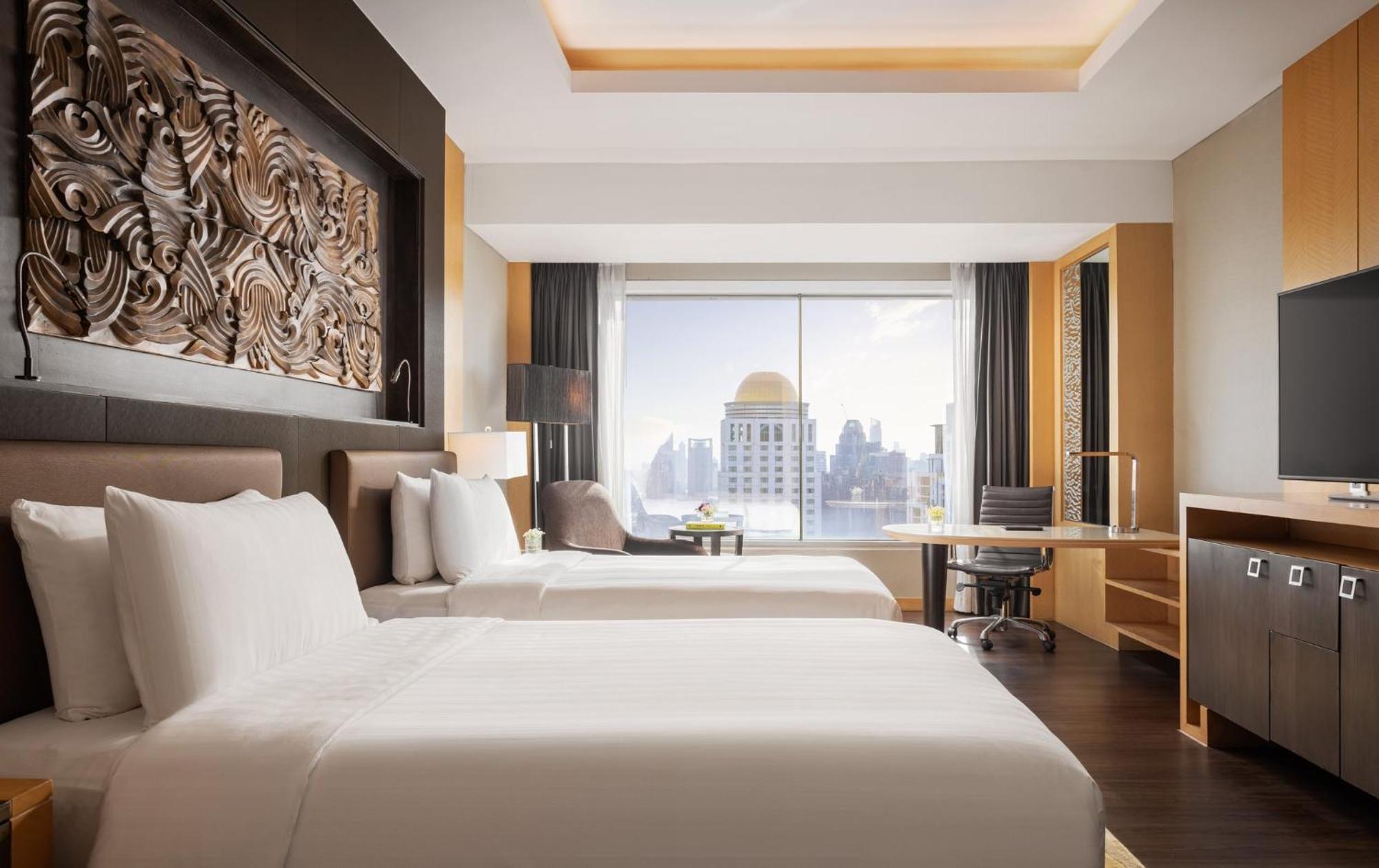 Habitación Grand Deluxe con 2 camas individuales y vistas al perfil urbano